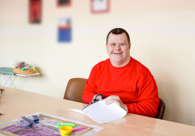 IDD Caregiver Guides & Toolkits for NC 17 guy with down syndrome does needlework