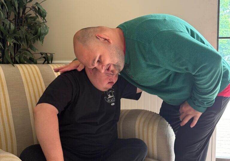 one man comforting another