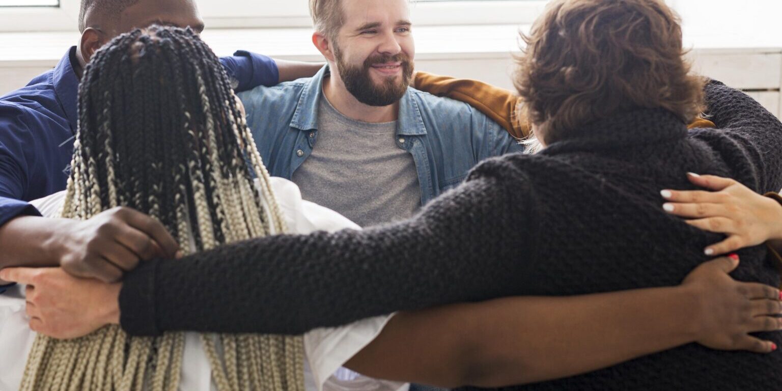 Medium Shot People Hugging Meeting